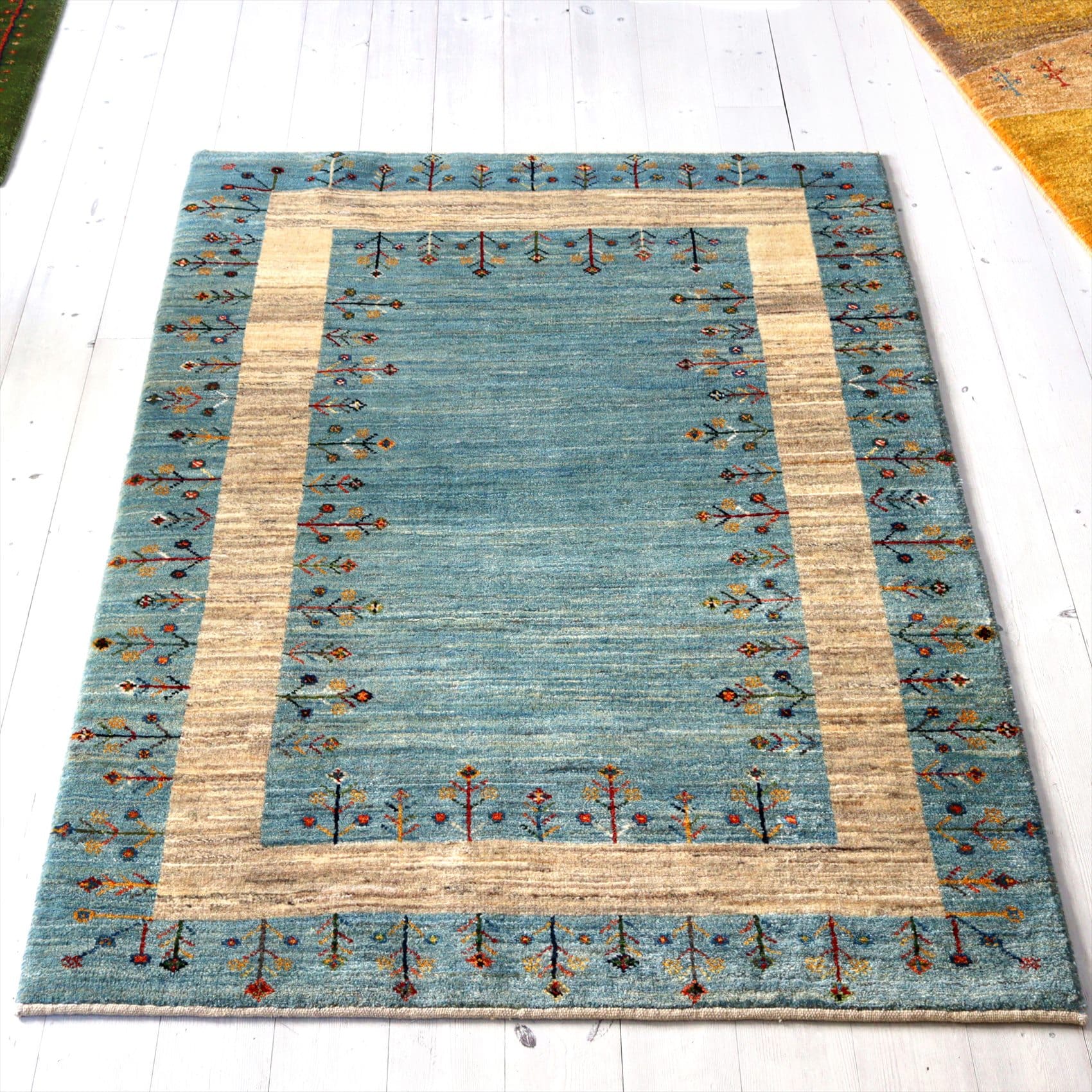 ギャッベ アマレ Amaleh151×105cm 色づく花々/ライトブルー